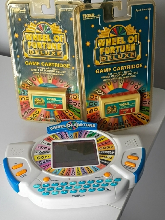 Tiger Electronics Other - 1998 Tiger Electronics Wheel of Fortune Deluxe handheld game  two game cartridge